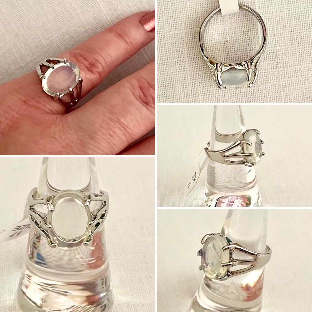 A clear white oval stone on a silvertone ring, US size  6 1/4-6 1/2, NEW